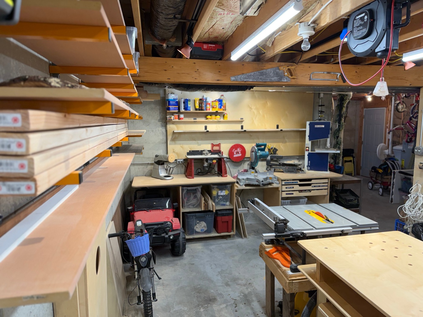 Back wall with miter saw station and lumber rack