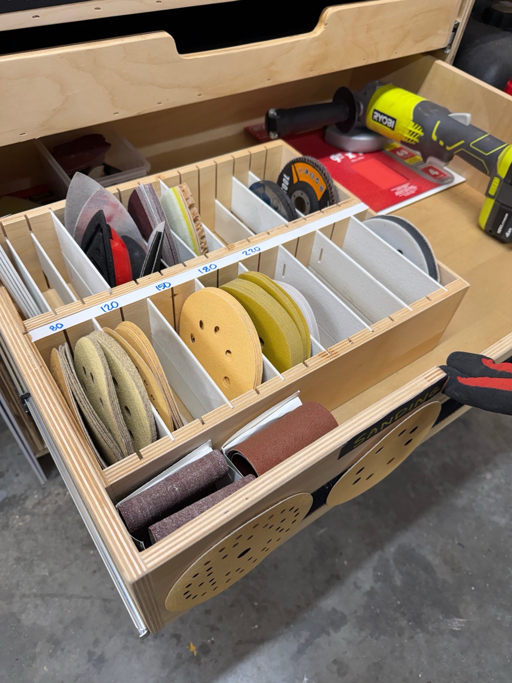 Sandpaper organized by grit in dividers