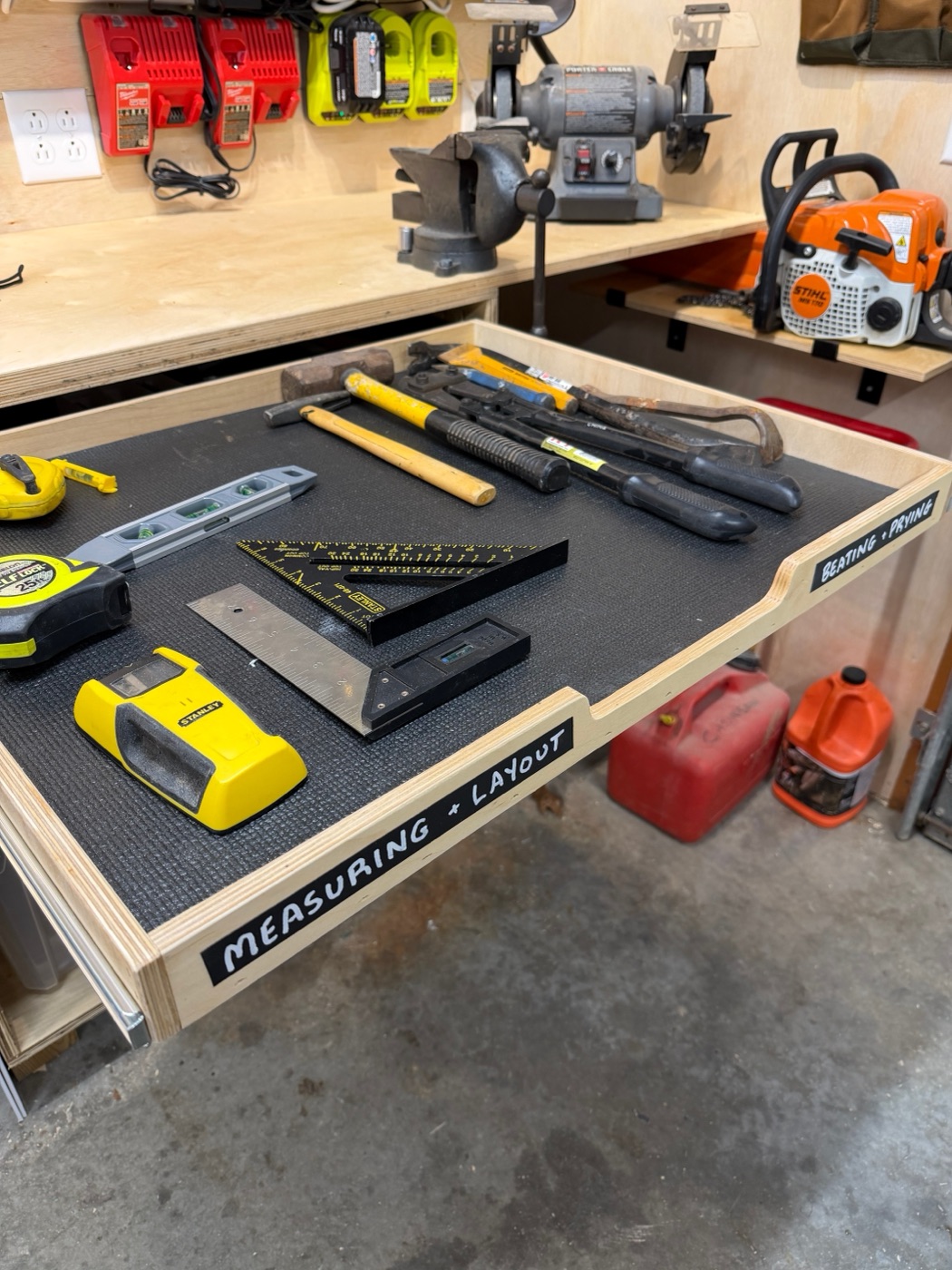 Measuring and layout tools in pullout drawer