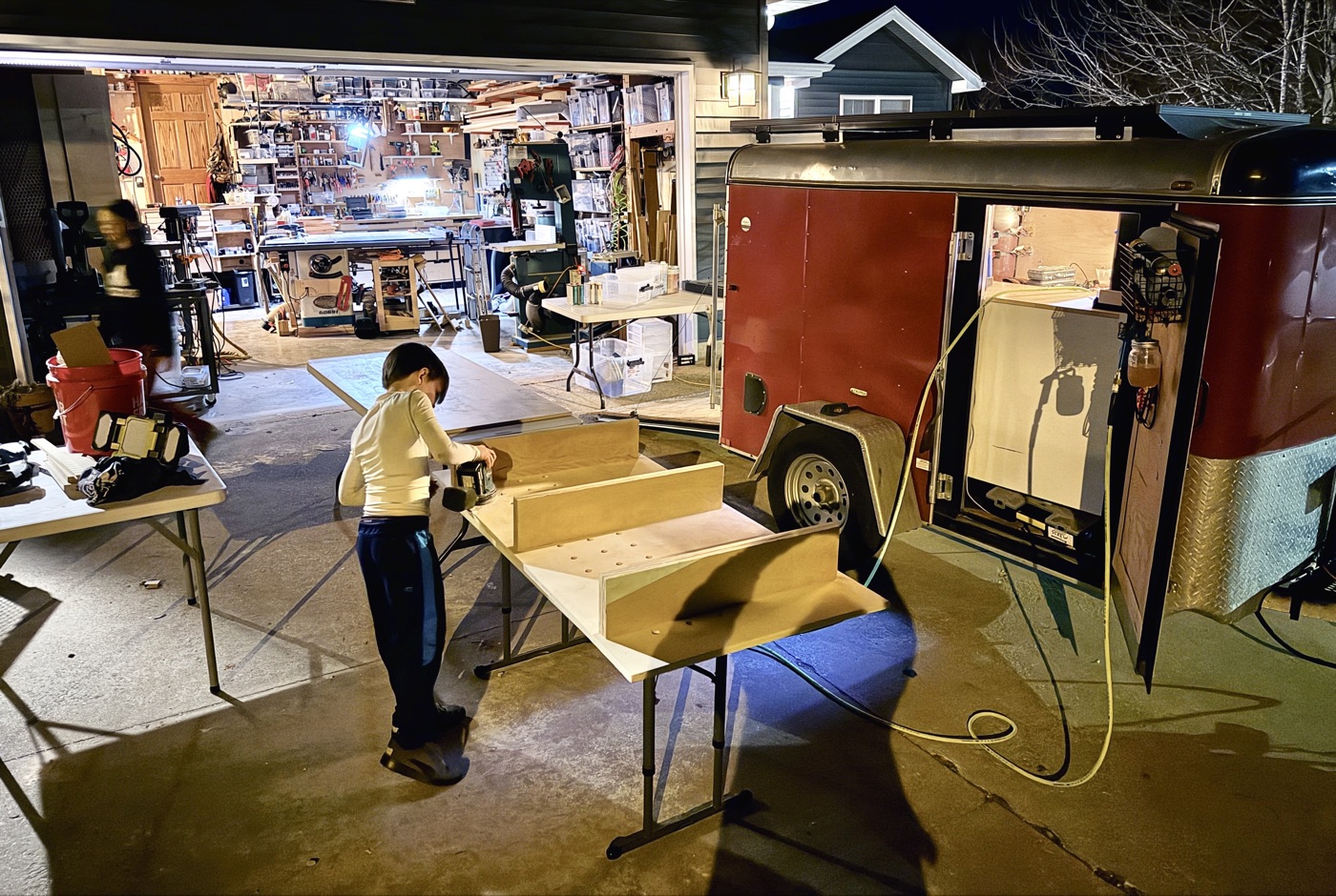 Building in driveway between trailer and garage