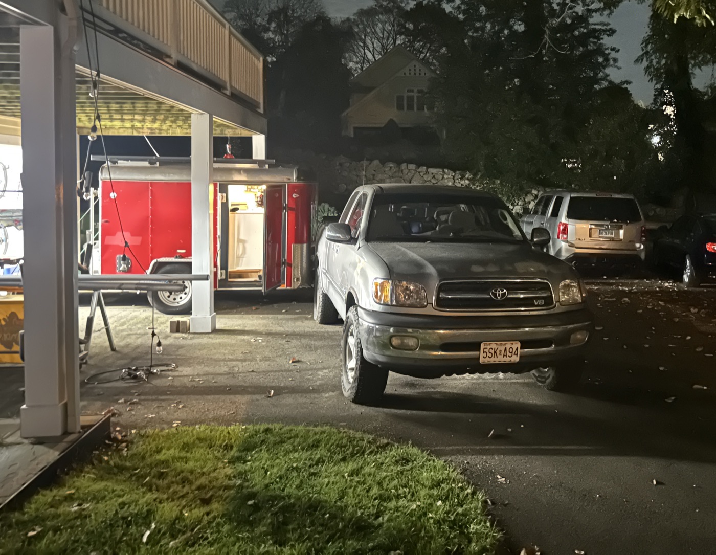 Red trailer hitched to pickup truck