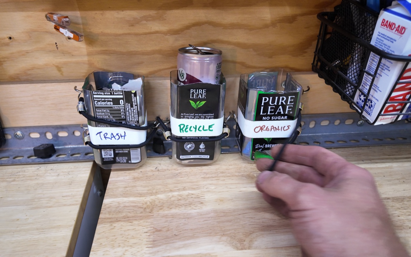 Repurposed bottles as labeled mini trash bins