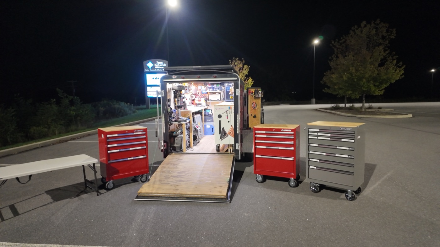 Trailer fully deployed in parking lot at night